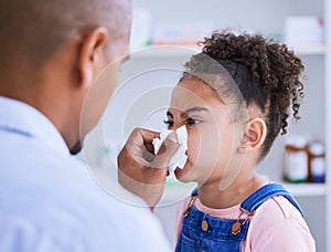 Blowing nose, child and doctor with sick, disease and virus in a hospital or clinic. Paediatrician, young girl and