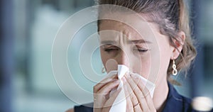 Blowing nose, flu and sick business woman in modern office, covid 19 risk or allergy symptom, tissue and cold. Female