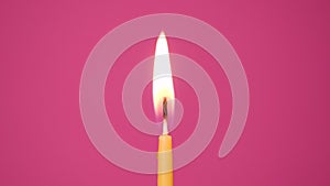 Blowing out cake candle burning on a pink background. Close up on blow out of yellow cake candle. Full HD resolution