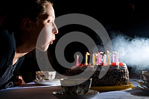 Blowing out candles on cake