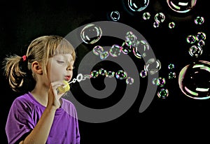 Blowing soap bubbles