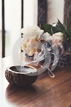 Blown out candle smoke, in home interior setting