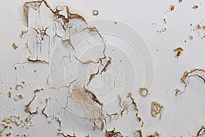 Blown plaster on an old internal wall. Damaged damp plasterwork photo