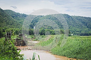 Blows irrigation, wood machinery that can divert water from low to high places without using oil. The wisdom of the local people t photo