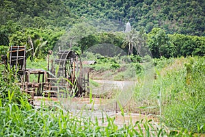 Blows irrigation, wood machinery that can divert water from low to high places without using oil. The wisdom of the local people photo