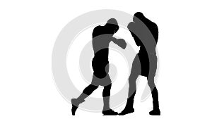 Blows to the body, two men boxers sparring. Silhouette