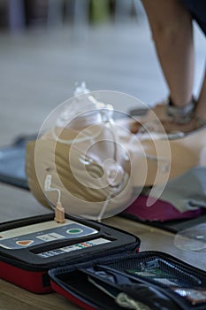 BLSD. First aid training concept. The use of an automatic external defibrillator in conducting a basic cardiopulmonary