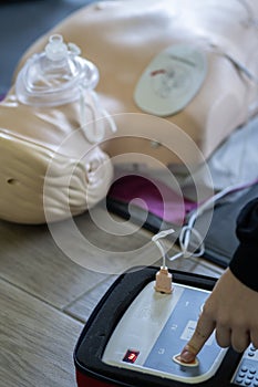 BLSD. First aid training concept. The use of an automatic external defibrillator in conducting a basic cardiopulmonary