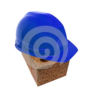 Blu helmet on brick