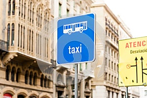 Blu street sign of taxy in european city street with daylightwith nobody, a common symbol for taxy