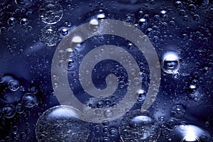 Blue abstract background with agglomeration of bubbles