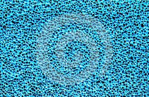 Blue abstract background of a porous material, texture