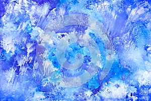 Blue abstract background with splashes painted in watercolor
