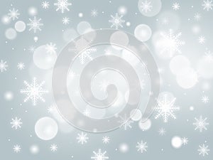 Blue abstract background. white light and snowflakes bokeh winter for Christmas new year blurred beautiful shiny lights
