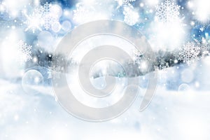 Blue abstract background. white light and snowflakes bokeh winter for Christmas new year blurred