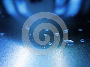 Blue abstract hi-tech background with drops of water