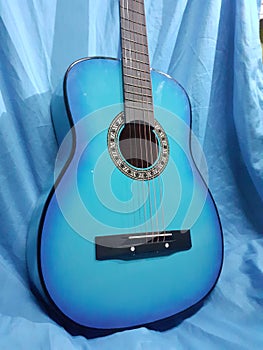 Blue  acoustic guitar close-up