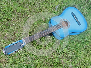 Blue  acoustic guitar close-up outdoor