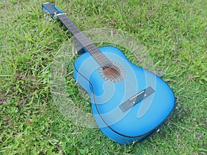 Blue  acoustic guitar close-up outdoor