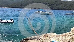 Blue adriatic sea in the bay, Rabac, istria, Croatia. Boats by the sea in summer