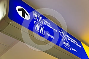 Blue airport direction sign