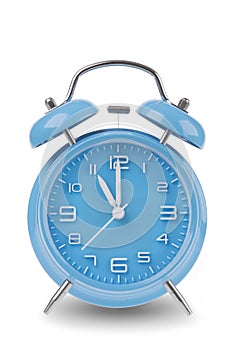 Blue alarm clock with the hands at 11 am or pm isolated on a white background