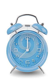 Blue alarm clock with the hands at 12 am or pm midnight or noon isolated on a white background