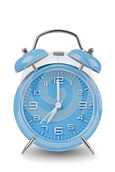 Blue alarm clock with the hands at 7 am or pm isolated on a white background photo