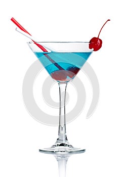 Blue alcohol cocktail in martini glass isolated