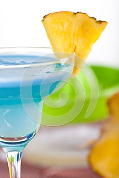 Blue alcohol cocktail with pineapple