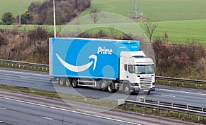 Blue Amazon lorry in motion on the British motorway M1