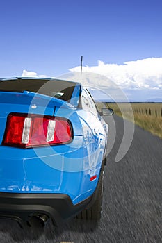 Blue American Sports Car On The Open Road