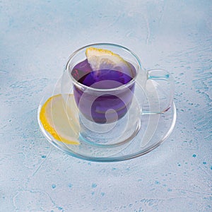 Blue anchan tea on the blue background. Blue tea Butterfly pea with lemon photo