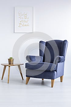 Blue armchair and side table