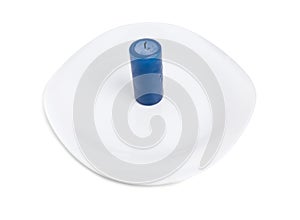 Blue aroma candle on the plate.