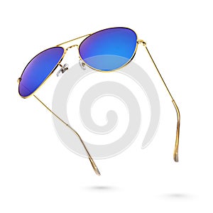 Blue aviator sunglasses with golden frame isolated on white