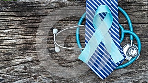 Blue awareness ribbon for prostate cancer, men health in November with light blue bow color on medical doctor record, male patient