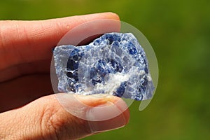 Blue Azurite rock from Morocco held in a hand