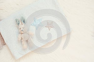 Blue Baby Blanket And Bunny Toy On A White Fur Carpet. Baby Mockup. Newborn Concept. Baby Boy Shower Invitation