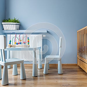 Blue baby room with cot
