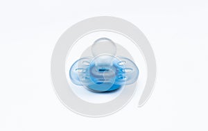 Blue baby`s pacifier on white background