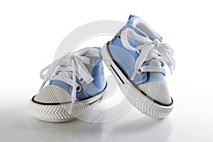 Blue baby shoes with reflection
