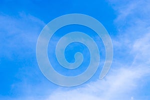 The blue backdrop has some clouds.