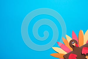 Blue background with copy space. paper craft for kids. DIY Turkey made for thanksgiving day.