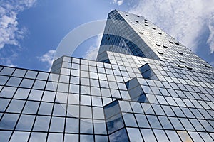 Blue background of glass high rise building skyscrapers