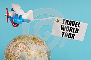 On a blue background, a globe and an airplane with a sign - Travel world tour