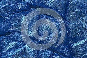 Blue background for graphic design.  Backdrop looks like stones or scales of reptile skin. photo