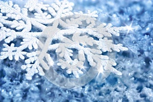 Blue background with ice and a large snowflake