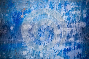 Blue background with ink texture on metal.