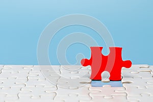 Blue background made from red and white  puzzle pieces and place for your content